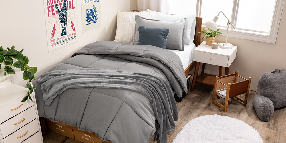 Bed styled with gray Ultimate Bed In A Bag and wood nightstand