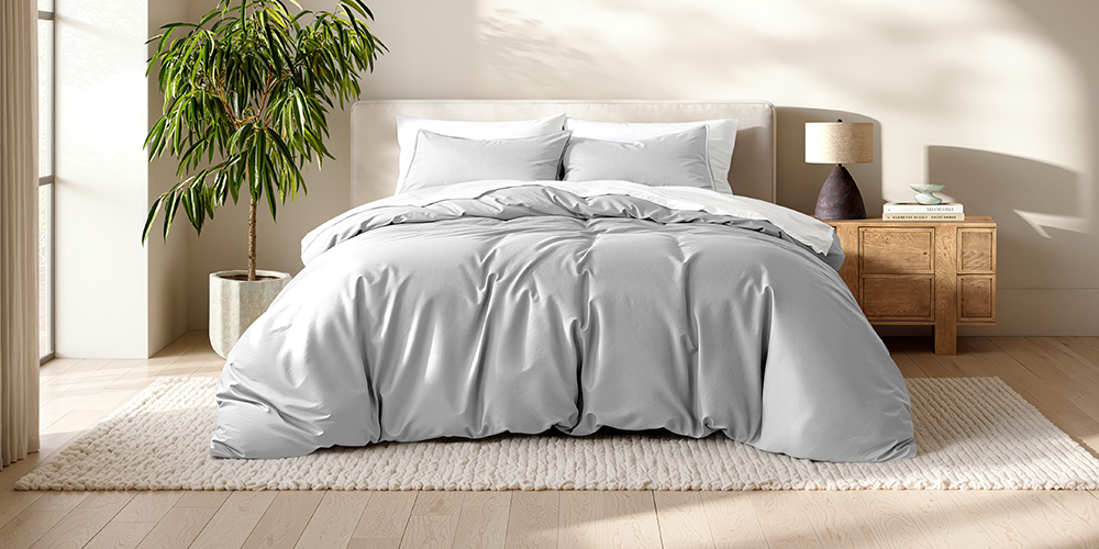 Bed styled with light gray Ultra Soft Duvet Cover Set and wood nightstand