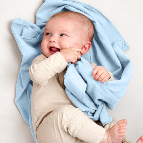 Baby wrapped in a light blue cotton flannel receiving blanket
