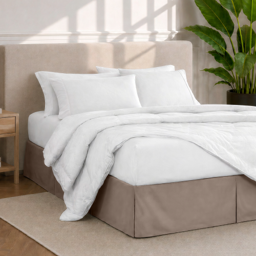 Bed with a white pleated bed skirt