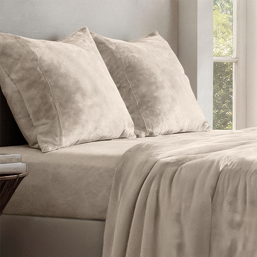 Bed styled with light gray Microplush Fleece Sheet Set, closeup