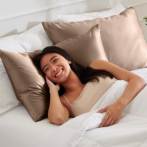 Woman sleeping on a white mulberry silk pillowcase set