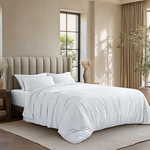 Bed styled with white Organic Cotton Jersey Duvet Cover Sham Set in a bedroom