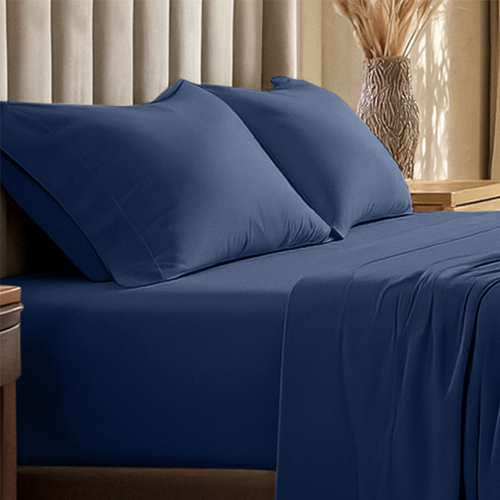 Closeup of navy blue Organic Cotton Jersey Sheet Set on bed