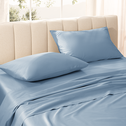 Stack of pillows with light blue Organic Cotton Sateen Pillowcase Set
