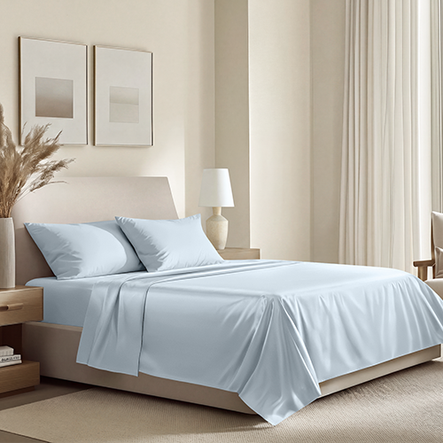 Bed styled with light blue Organic Cotton Sateen Sheet Set