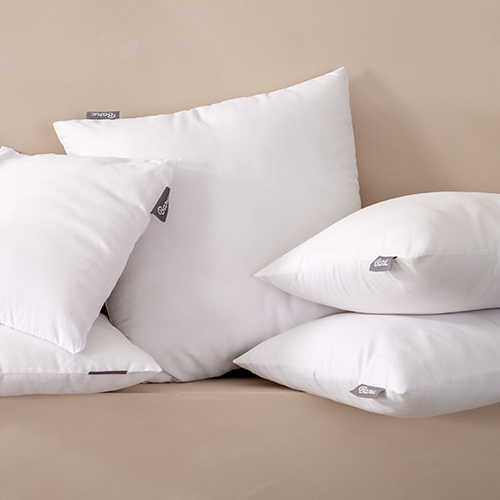 Two white pillows with Pillow Inserts stacked together