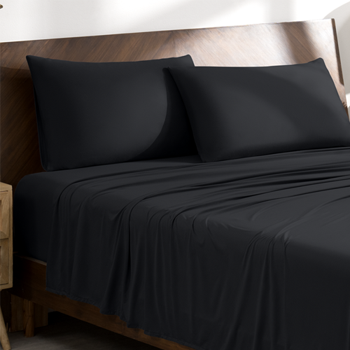 Bed with black Stretch Knit Sheet Set, closeup