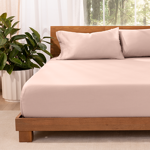 Bed with pink TENCEL Lyocell Pillowcase Set, closeup