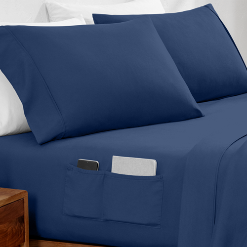 Bed with navy blue Ultra Soft Dual Side Pocket Sheet Set showing side pocket detail
