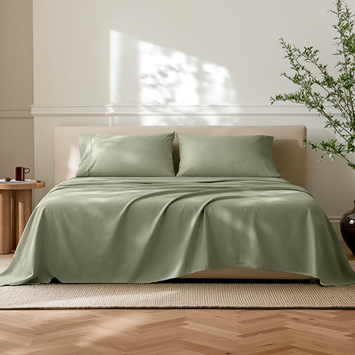 Bed styled with sage green Ultra Soft Neutrals Lights Sheet Set