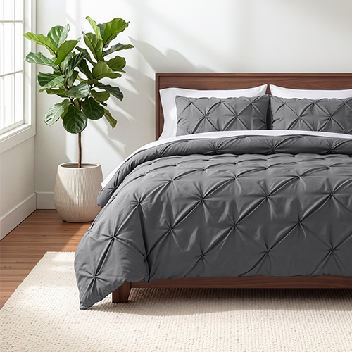 Bed styled with dark gray Ultra Soft Pintuck Comforter Set