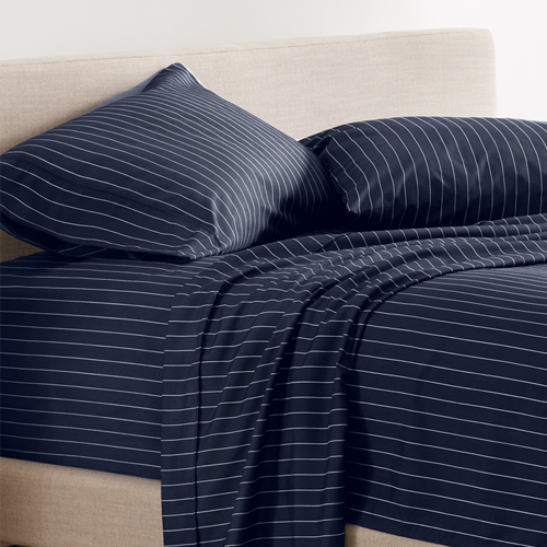 Bed with navy blue striped Ultra Soft Prints Sheet Set, closeup