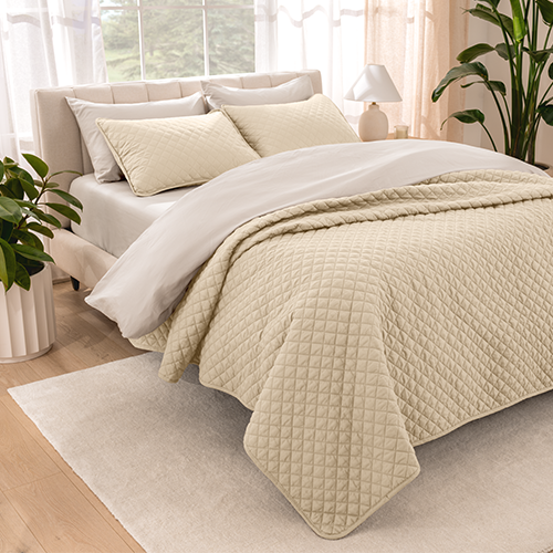 Bed styled with tan quilted Ultra Soft Quilt Set