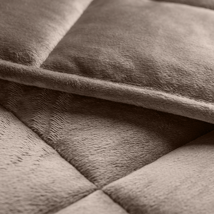 Close-up of folded taupe minky fleece texture