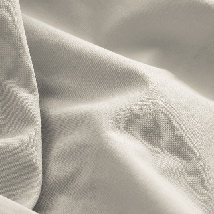 Closeup of sage green Organic Cotton Percale Dorm Bundle fabric texture, draped