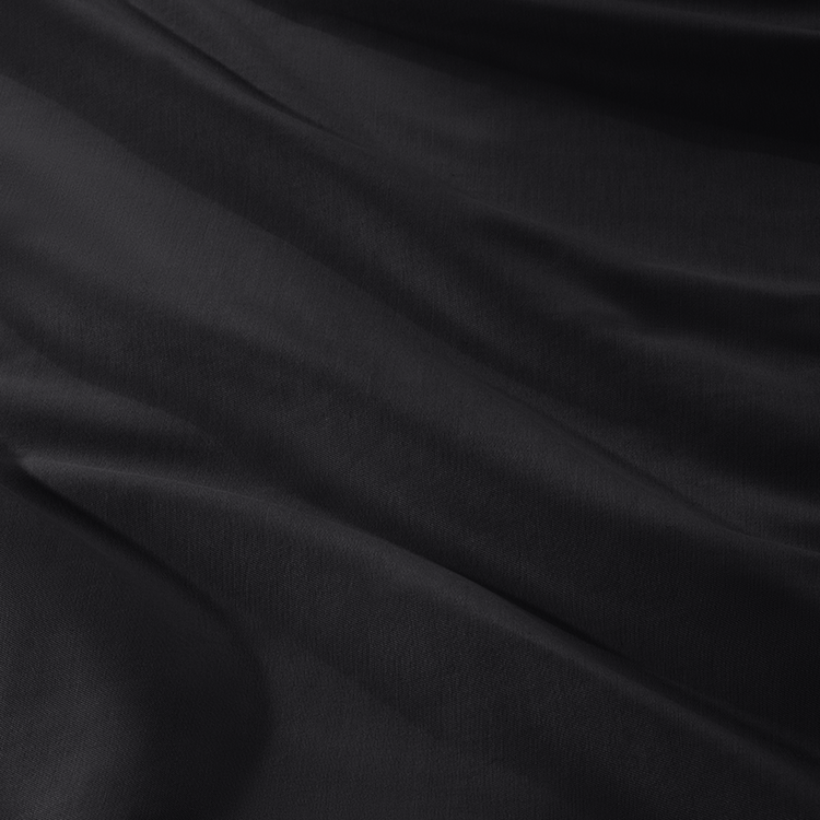 Closeup of black Organic Cotton Sateen Bedding Bundle fabric