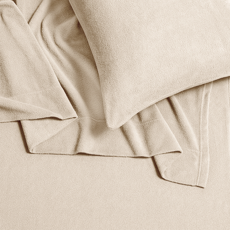 Closeup of cream Polar Fleece Sheet Set fabric texture