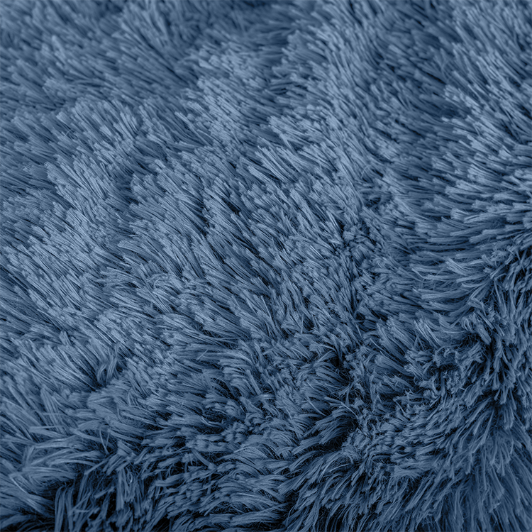 Closeup of navy blue Shaggy Faux Fur Sherpa Blanket fabric texture