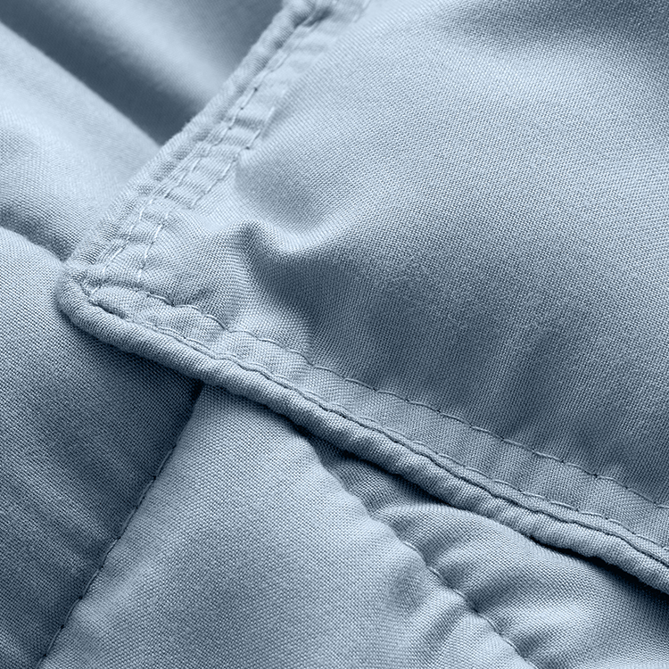Closeup of light blue Ultra Soft Box Stitch Comforter Set fabric with box-stitch texture
