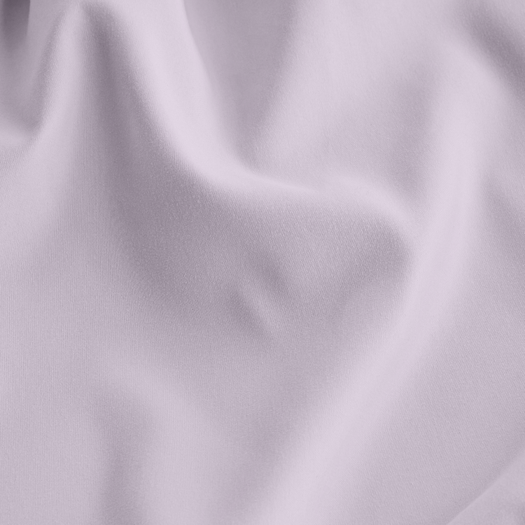 Close-up of lavender crib sheet fabric texture