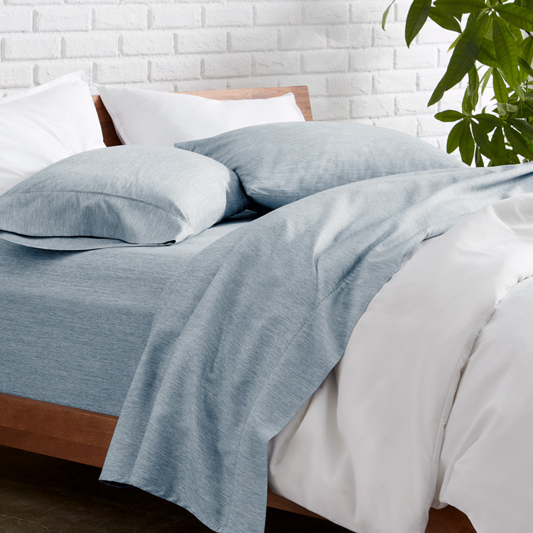 Bed styled with light blue Ultra Soft Heather Sheet Set
