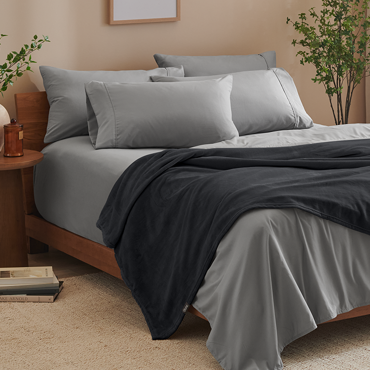 Bed with gray Microplush Blanket, closeup