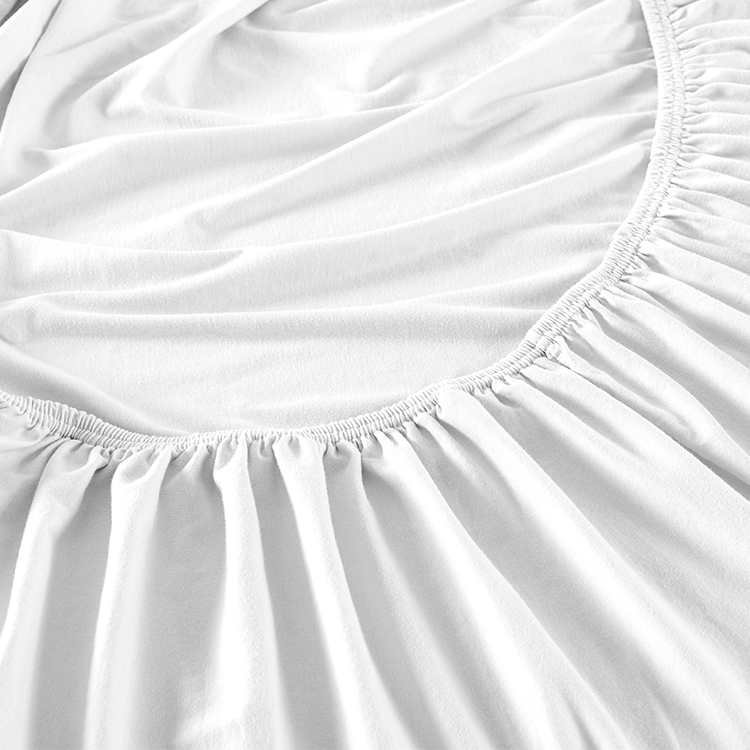 Closeup of white Organic Cotton Jersey Fitted Sheet fabric texture