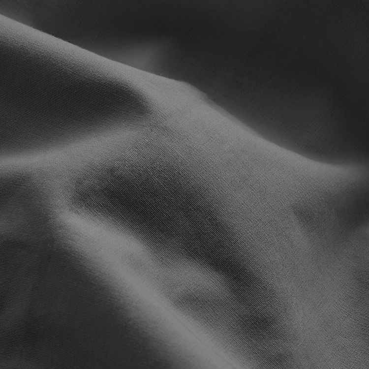 Closeup of dark gray Organic Cotton Percale Fitted Sheet fabric texture