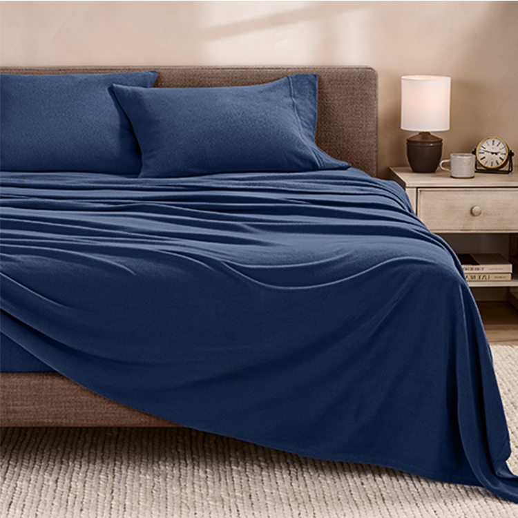 Bed styled with navy blue Polar Fleece Sheet Set