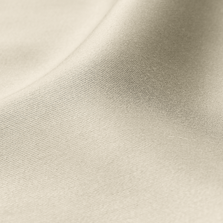 Closeup of cream TENCEL Lyocell Sheet Set fabric texture