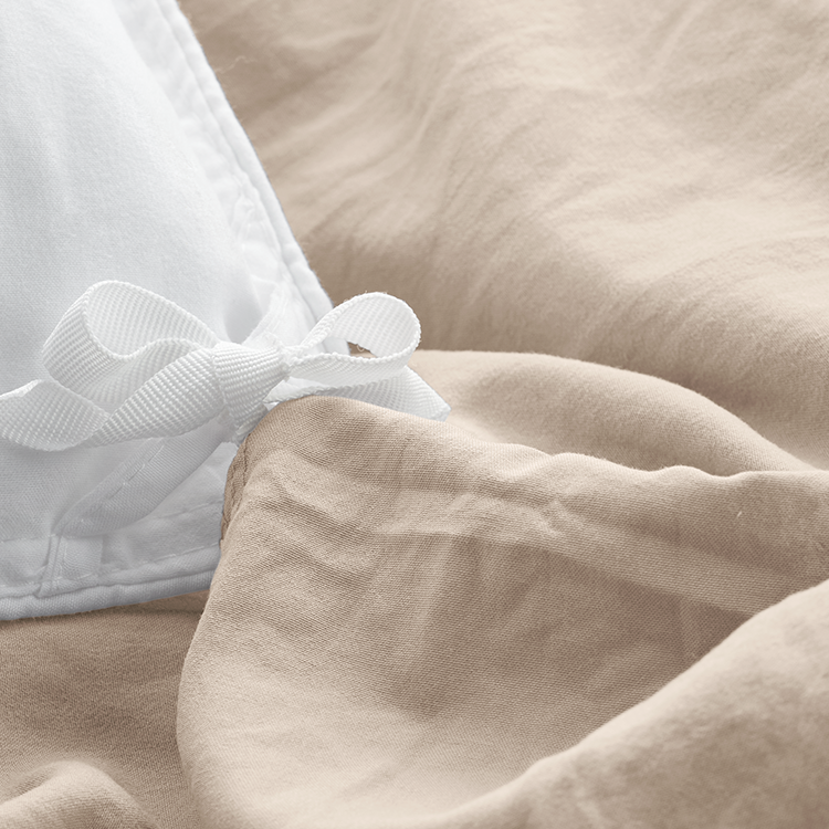 Closeup of taupe Ultra Soft Washed Duvet Cover Set fabric with tie closure