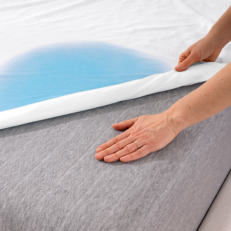 Closeup of Cotton Terry Mattress Protector layered on a mattress edge