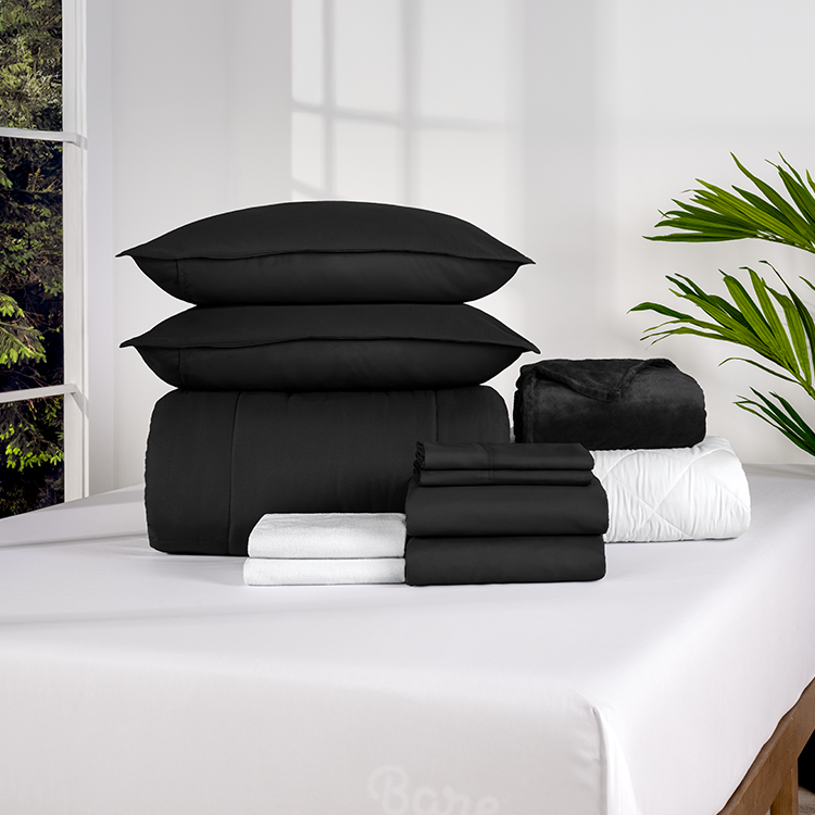 Stack of folded black Ultimate Bed In A Bag pieces