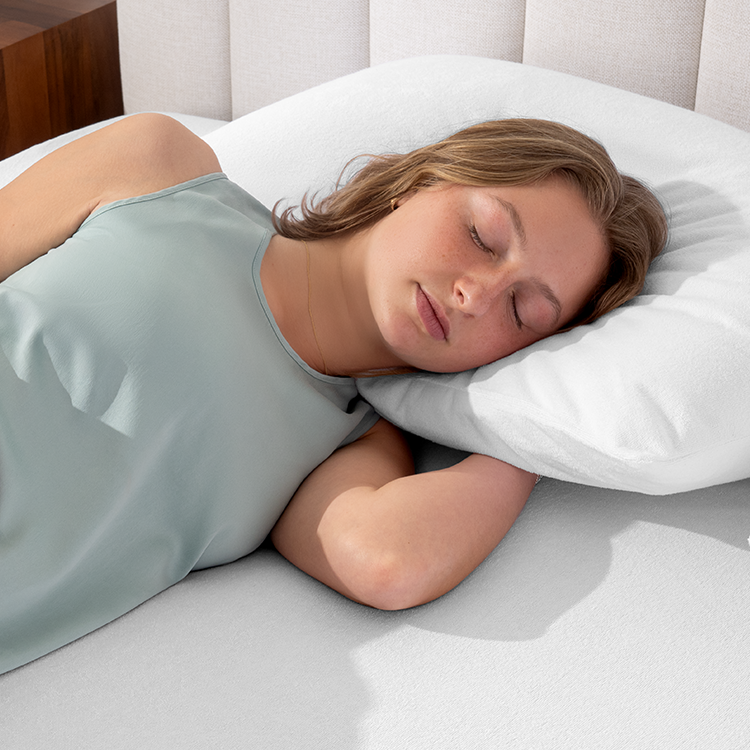 Woman sleeping on a pillow with white Cotton Terry Pillow Protector
