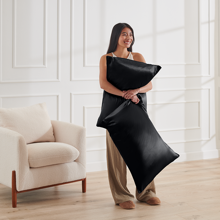 Woman standing wearing a black satin robe