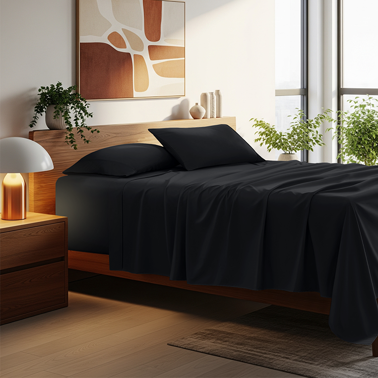 Bed with dark navy Ultra Soft 22 Inch Pocket Sheet Set in a dim bedroom