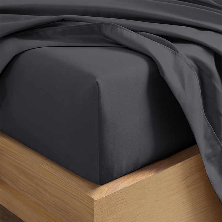 Closeup of dark gray Ultra Soft Fitted Sheet on a mattress corner