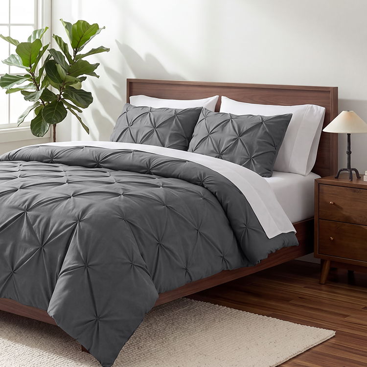 Bed with dark gray Ultra Soft Pintuck Comforter Set, plant nearby