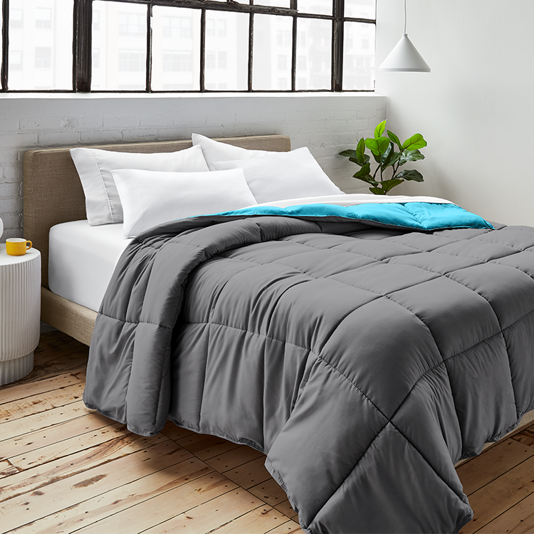 Bed with dark gray Ultra Soft Reversible Comforter and teal throw