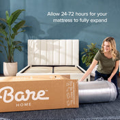 A woman unpacks a mattress from a clear plastic wrap next to a large cardboard box labeled Bare HOME