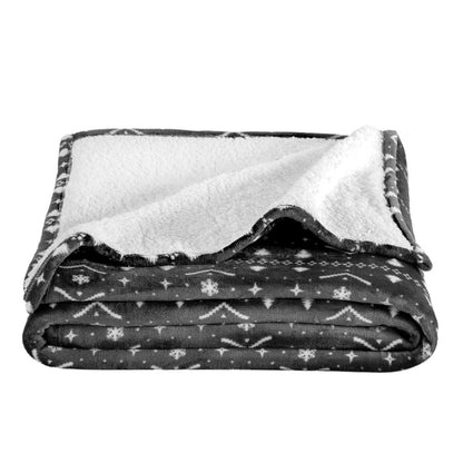 Folded blanket with black and white pattern on a white background