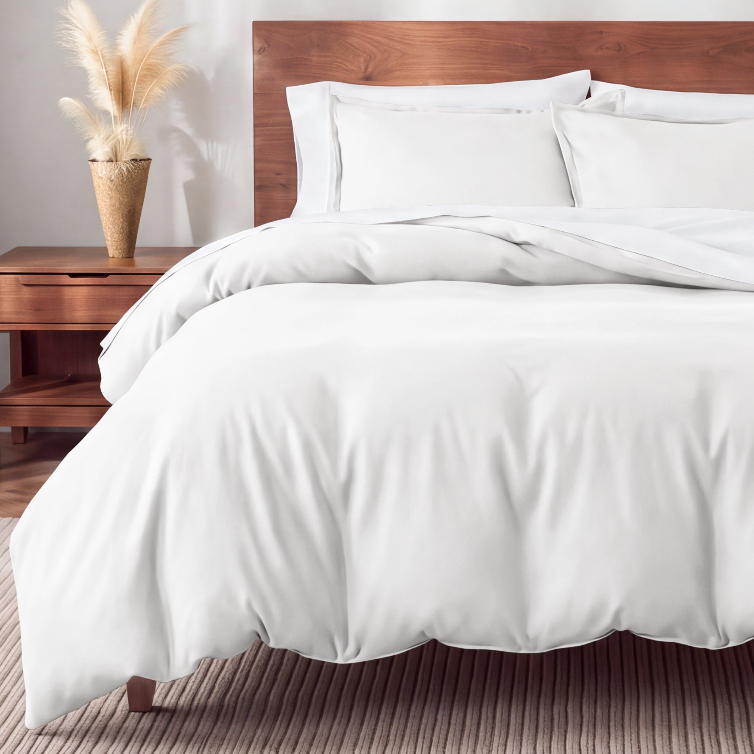 Flannel bedding set on a bed in a bedroom with a nightstand and lamp.