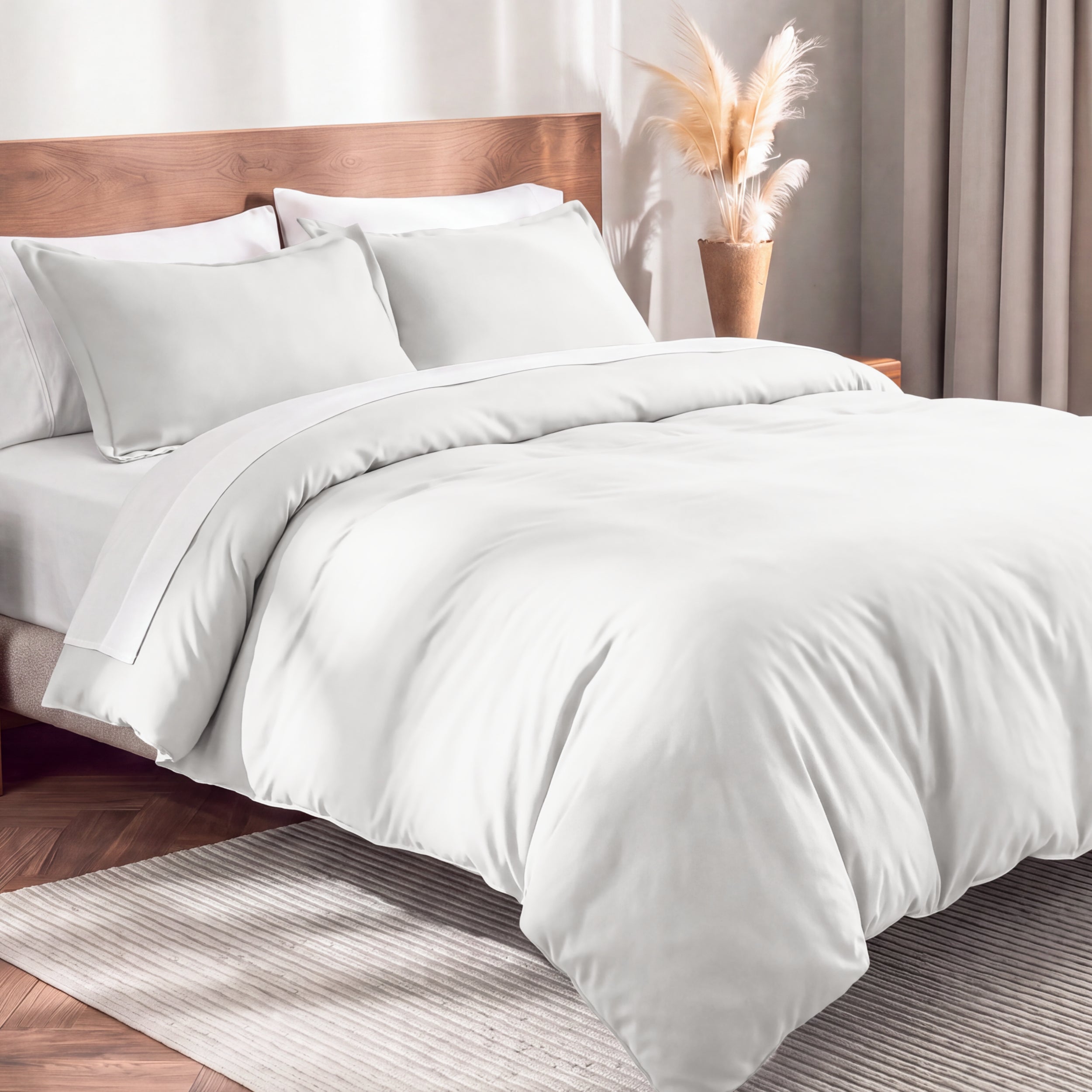 Flannel duvet cover set on a bed in a bedroom with a lamp and plant in the background.