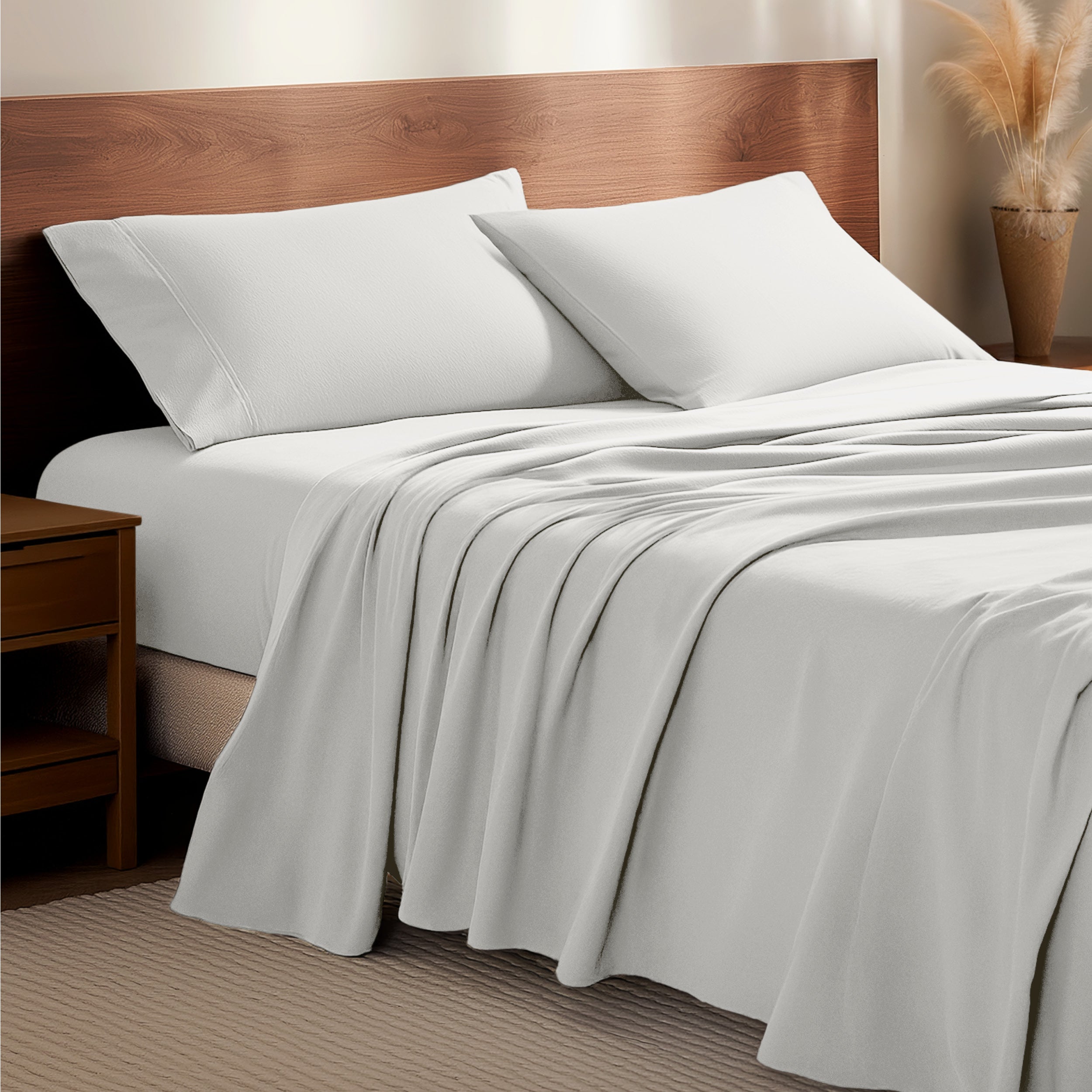 Flannel bedding set on a bed with a wooden headboard and side table