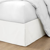 Ultra soft bed skirt on a bed with white bedding.