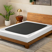Antique white box spring cover on a box spring