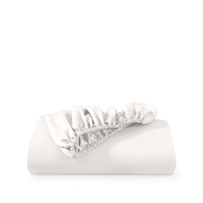 A deep pocket fitted sheet folded on a white background