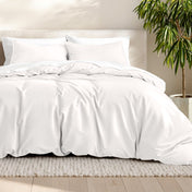 Microfiber bedding set on a bed with a neutral background