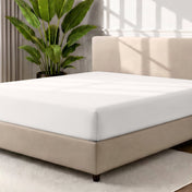 Ultra soft fitted sheet on a mattress with the sun shining into the bedroom